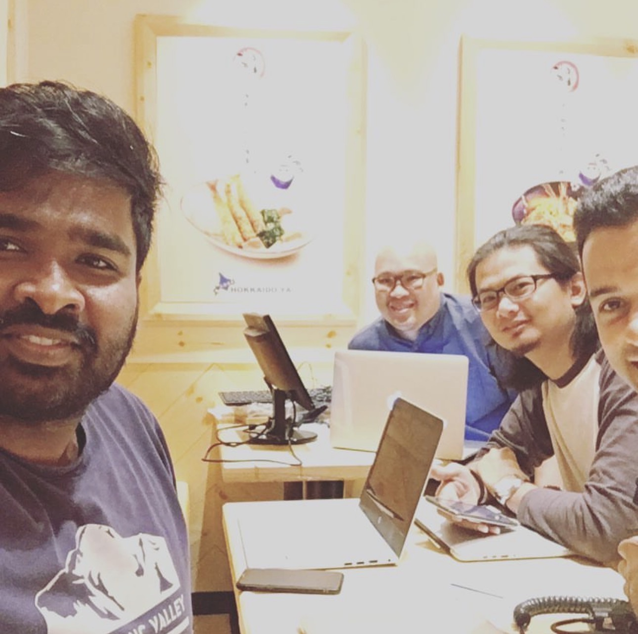 The team that built this, working from a restaurant table